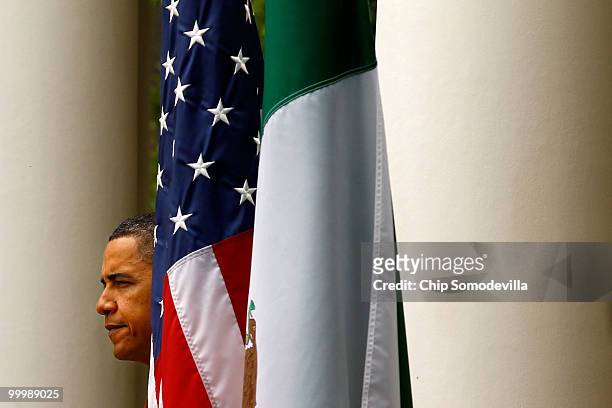 President Barack Obama walks out into the Rose Garden for a joint press conference with Mexican President Felipe Calderon at the White House May 19,...