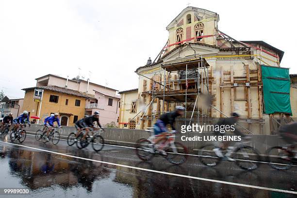 The pack rides past a village hit by an eartquake in 2009 during the11 st stage of the 93rd Giro d'Italia going from Lucera to L'Aquila on May 19,...