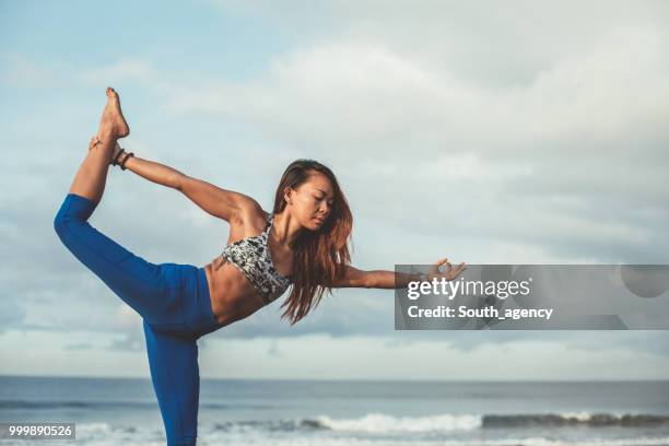 beautiful woman stretching - south_agency stock pictures, royalty-free photos & images