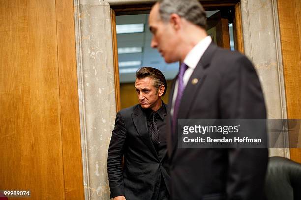 Actor Sean Penn arrives behind Sen. Bob Casey for a hearing on the aftermath of the earthquake in Haiti on Capitol Hill on May 19, 2010 in...