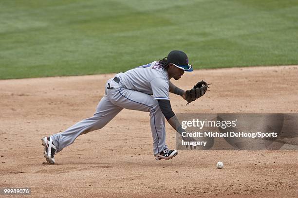 Jose Reyes of the New York Mets goes after a dropped ball during a MLB game against the Florida Marlins in Sun Life Stadium on May 16, 2010 in Miami,...