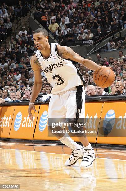 George Hill of the San Antonio Spurs drives the ball against the Orlando Magic during the game on April 2, 2010 at the AT&T Center in San Antonio,...