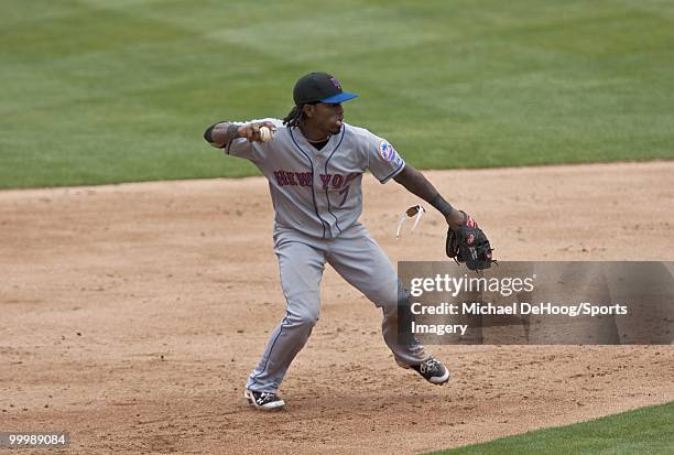 Jose Reyes of the New York Mets throws to first base during a MLB game against the Florida Marlins in Sun Life Stadium on May 16, 2010 in Miami,...