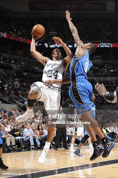 Richard Jefferson of the San Antonio Spurs puts a shot up against Rashard Lewis of the Orlando Magic during the game on April 2, 2010 at the AT&T...