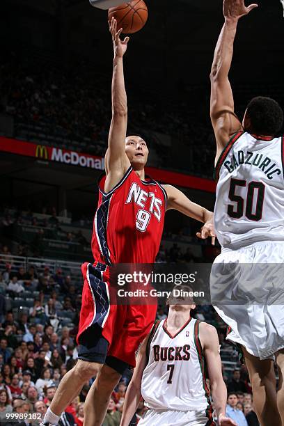 Yi Jianlian of the New Jersey Nets puts a shot up against the Milwaukee Bucks during the game at the Bradley Center on April 7, 2010 in Milwaukee,...