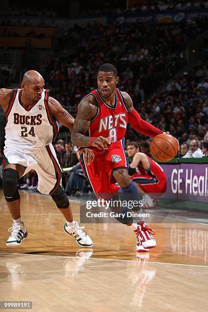 Terrence Williams of the New Jersey Nets drives the ball against Jerry Stackhouse of the Milwaukee Bucks during the game at the Bradley Center on...