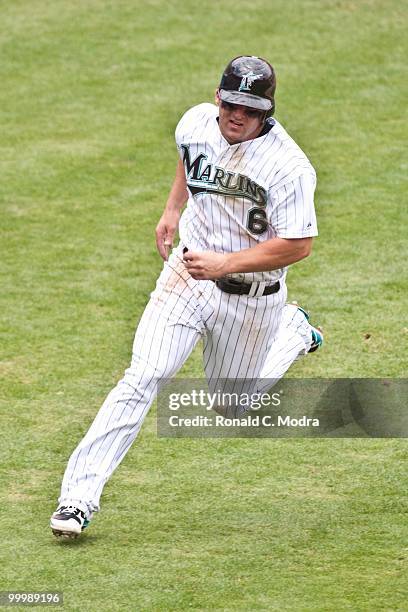 Dan Uggla of the Florida Marlins runs to third base during a MLB game against the New York Mets in Sun Life Stadium on May 16, 2010 in Miami, Florida.