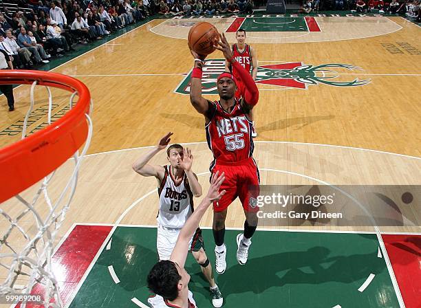 Keyon Dooling of the New Jersey Nets puts a shot up against the Milwaukee Bucks during the game at the Bradley Center on April 7, 2010 in Milwaukee,...