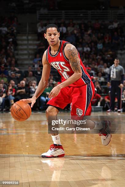 Devin Harris of the New Jersey Nets drives the ball against the Milwaukee Bucks during the game at the Bradley Center on April 7, 2010 in Milwaukee,...