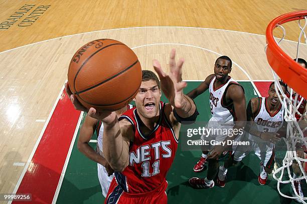 Brook Lopez of the New Jersey Nets puts a shot up against the Milwaukee Bucks during the game at the Bradley Center on April 7, 2010 in Milwaukee,...