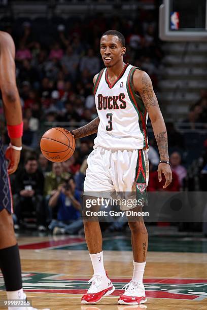 Brandon Jennings of the Milwaukee Bucks dribbles the ball against the New Jersey Nets during the game at the Bradley Center on April 7, 2010 in...