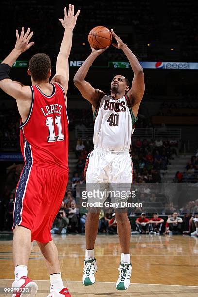 Kurt Thomas of the Milwaukee Bucks takes a shot against Brook Lopez OF the New Jersey Nets during the game at the Bradley Center on April 7, 2010 in...