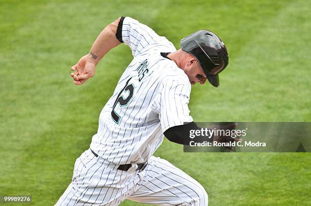 Cody Ross of the Florida Marlins runs to first base during a MLB game against the New York Mets in Sun Life Stadium on May 16, 2010 in Miami, Florida.