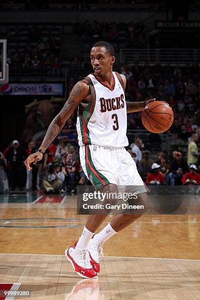 Brandon Jennings of the Milwaukee Bucks dribbles the ball against the New Jersey Nets during the game at the Bradley Center on April 7, 2010 in...
