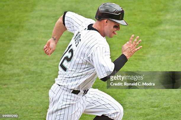 Cody Ross of the Florida Marlins runs to first base during a MLB game against the New York Mets in Sun Life Stadium on May 16, 2010 in Miami, Florida.