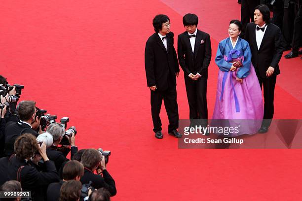 Director Chang-Dong Lee, actress Jeong-hee Yoon, actor David Lee, producer Jun-Dong Lee attend the "Poetry" Premiere at the Palais des Festivals...
