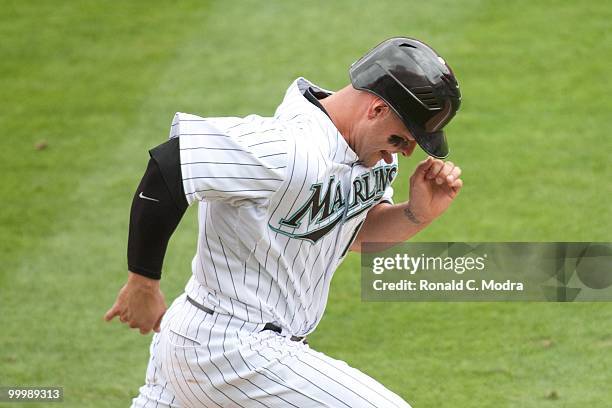 Cody Ross of the Florida Marlins runs to first base during a MLB game against the New York Mets in Sun Life Stadium on May 16, 2010 in Miami, Florida.