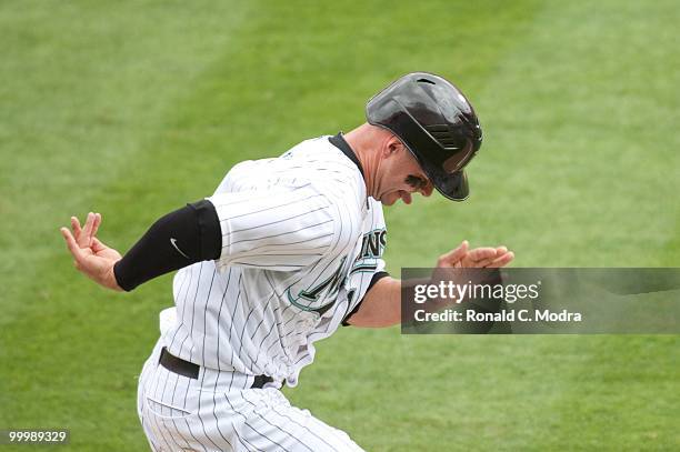 Cody Ross of the Florida Marlins runs to first base during a MLB game against the New York Mets in Sun Life Stadium on May 16, 2010 in Miami, Florida.