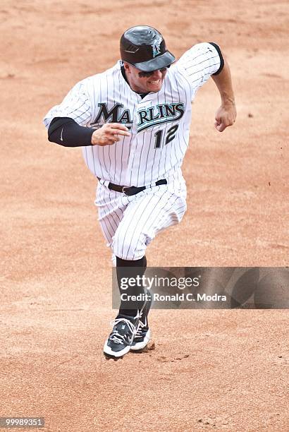Cody Ross of the Florida Marlins runs to third base during a MLB game against the New York Mets in Sun Life Stadium on May 16, 2010 in Miami, Florida.