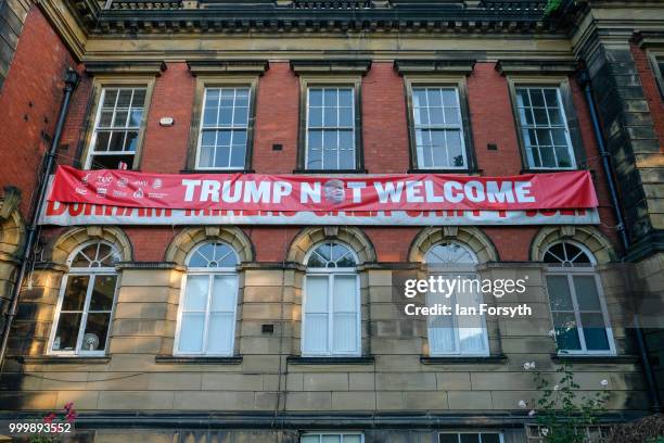 An anti Trump banner is attached to the Durham Miners' Association headquarters during the 134th Durham Miners’ Gala on July 14, 2018 in Durham,...