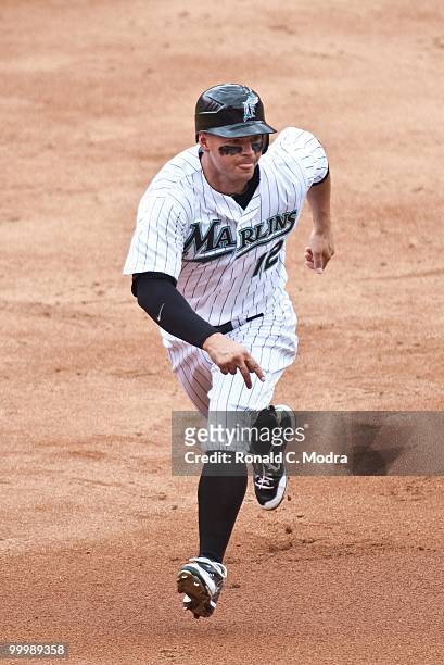 Cody Ross of the Florida Marlins runs to third base during a MLB game against the New York Mets in Sun Life Stadium on May 16, 2010 in Miami, Florida.