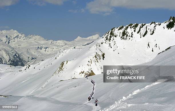 French national football team'splayers walk with snowshoes at the top of the Tignes glacier on May 19, 2010 in the French Alps. The French national...