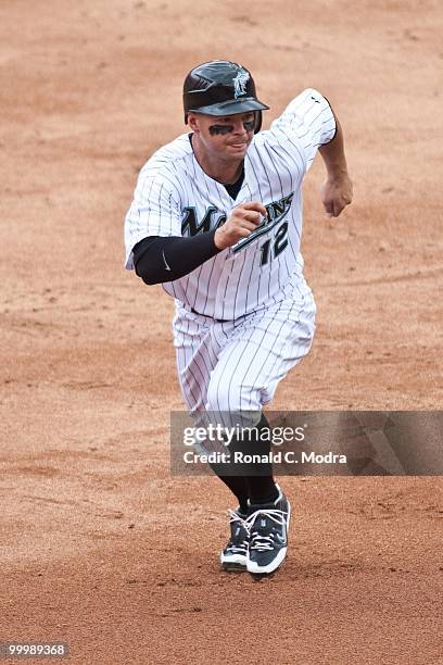 Cody Ross of the Florida Marlins runs to third base during a MLB game against the New York Mets in Sun Life Stadium on May 16, 2010 in Miami, Florida.