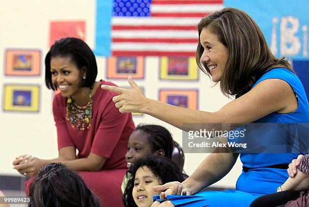 First lady Michelle Obama and her Mexican counterpart Margarita Zavala talk to second graders during a physical education class as they visit New...