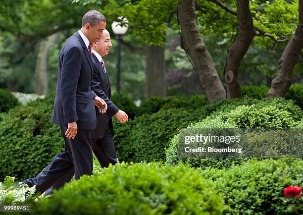 President Barack Obama, left, and Felipe Calderon, Mexico's president, leave a news conference in the Rose Garden of the White House in Washington,...