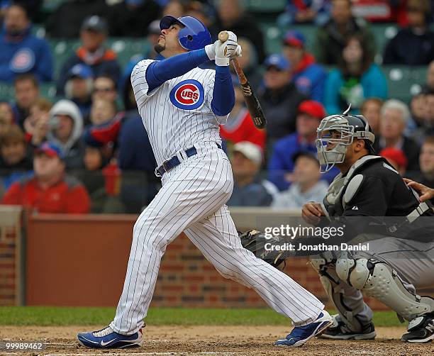 Geovany Soto of the Chicago Cubs hits the ball in front of Ronny Paulino of the Florida Marlins at Wrigley Field on May 12, 2010 in Chicago,...