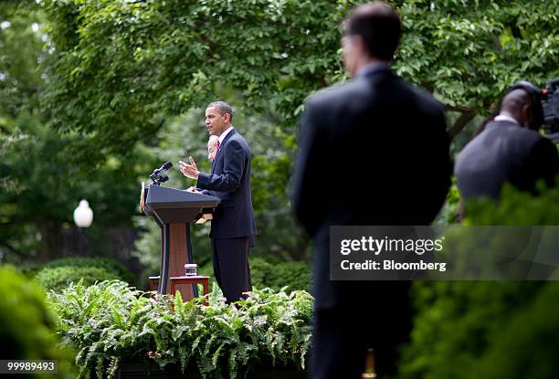 President Barack Obama, right, and Felipe Calderon, Mexico's president, hold a news conference in the Rose Garden of the White House in Washington,...