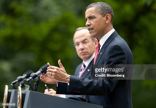 President Barack Obama, right, and Felipe Calderon, Mexico's president, hold a news conference in the Rose Garden of the White House in Washington,...