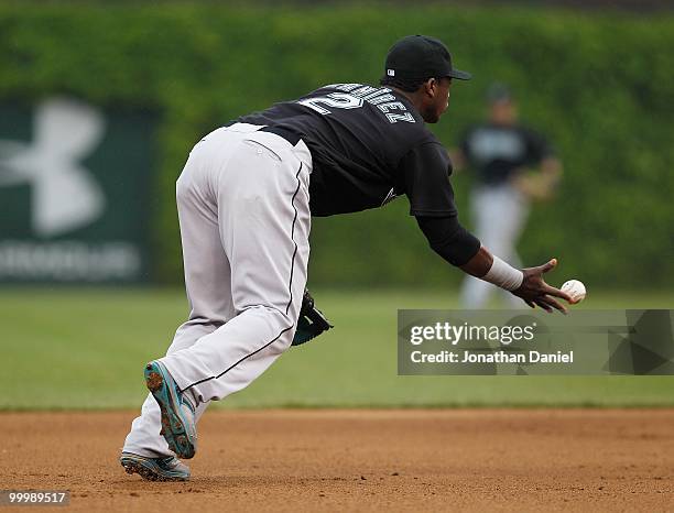Hanley Ramirez of the Florida Marlins flips the ball to a teammate against the Chicago Cubs at Wrigley Field on May 12, 2010 in Chicago, Illinois....