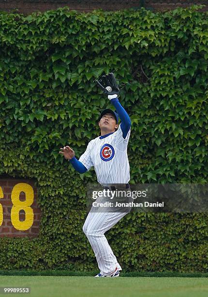 Kosuke Fukudome of the Chicago Cubs makes a catch in right field against the Florida Marlins at Wrigley Field on May 12, 2010 in Chicago, Illinois....