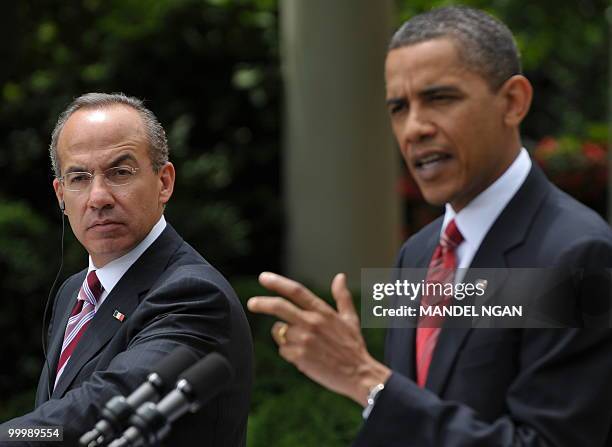 Mexico�s President Felipe Calderón watches as US President Barack Obama speaks during a joint press conference May 19, 2010 in the Rose Garden of the...