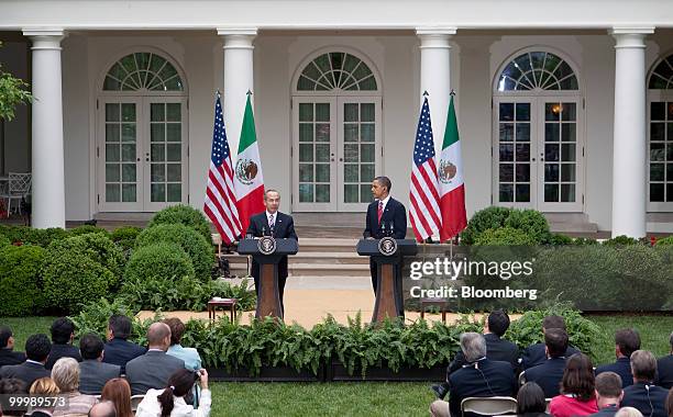 President Barack Obama, right, and Felipe Calderon, Mexico's president, hold a news conference in the Rose Garden of the White House in Washington,...