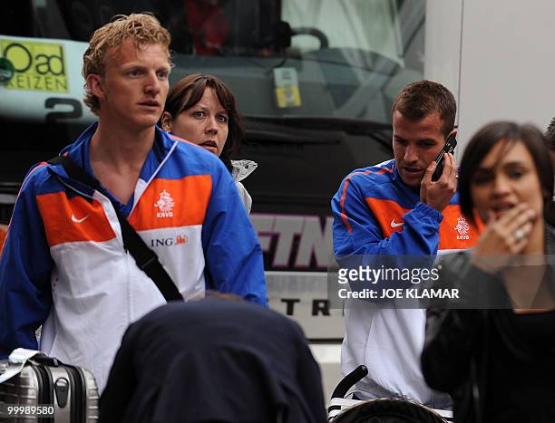 Dirk Kuyt and Rafael Van Der Vaart get out of a bus during the Dutch team's arrival for their training camp in the Tyrolian village of Seefeld in...