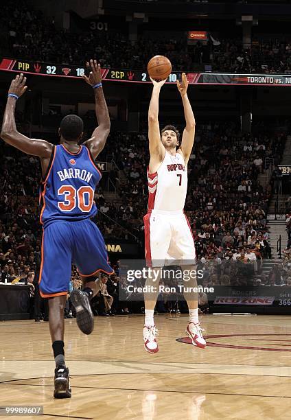 Andrea Bargnani of the Toronto Raptors shoots a jump shot against Earl Barron of the New York Knicks during the game at Air Canada Centre on April...