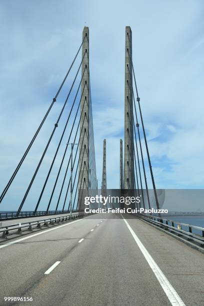 traffic on øresund bridge between sweden and denmark - cable stayed bridge stock pictures, royalty-free photos & images