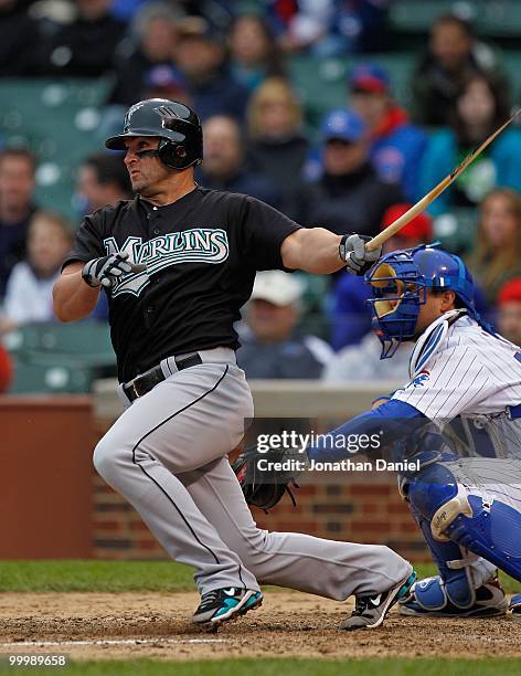 Dan Uggla of the Florida Marlins is left with a broken bat after a hit in the 8th inning against the Chicago Cubs at Wrigley Field on May 12, 2010 in...