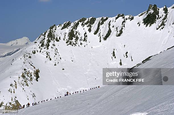 French national football team's players walk with snowshoes at the top of the Tignes glacier on May 19, 2010 in the French Alps. The French national...