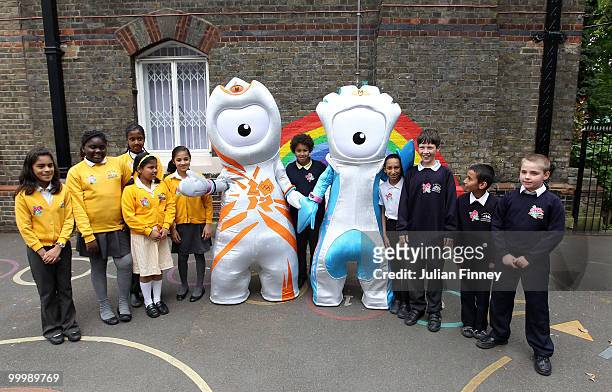 Wenlock, the Olympic mascot and Mandeville , the Paralympic mascot pose with school children after being unveiled at St Pauls Whitechapel C of E...