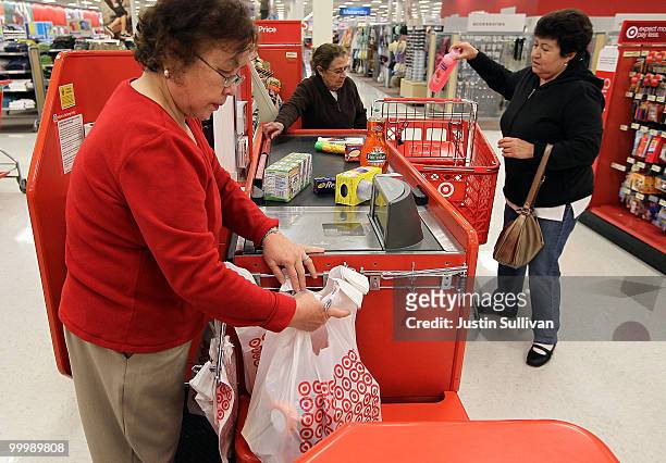Cashier helps a customer with a purchase at a Target store May 19, 2010 in Daly City, California. Target reported first quarter earnings up 29...