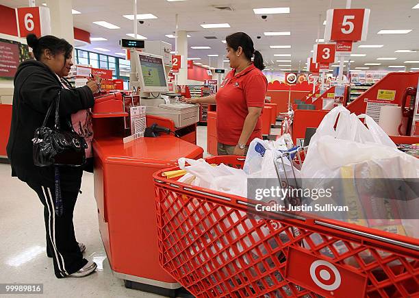 Cashier helps a customer with a purchase at a Target store May 19, 2010 in Daly City, California. Target reported first quarter earnings up 29...