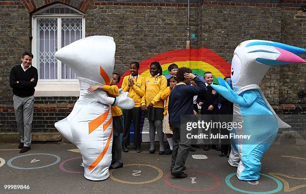 Sebastian Coe, chairman of the London 2012 organising committee, looks on as Wenlock, the Olympic mascot and Mandeville , the Paralympic mascot are...