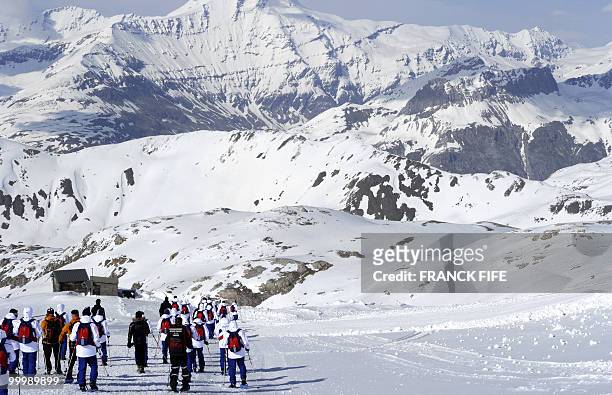 French national football team's players walk with snowshoes at the top of the Tignes glacier on May 19, 2010 in the French Alps. The French national...