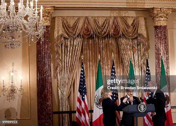 Secretary of State Hillary Rodham Clinton , Vice President Joseph R. Biden and Mexico's President Felipe Caldero toast during a luncheon at the US...