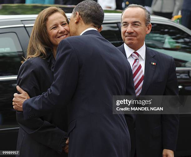 President Barack Obama kisses Margarita Zavala, the wife of Mexico�s President Felipe Calderón May 19, 2010 during the welcome ceremony on the South...