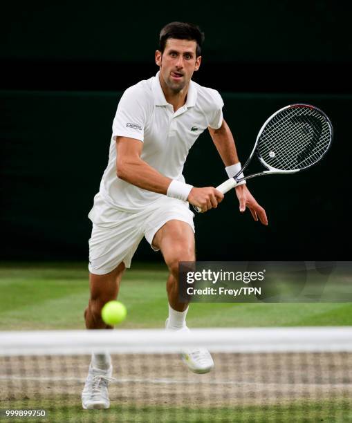 Novak Djokovic of Serbia in action against Rafael Nadal of Spain in the semi final of the gentlemen's singles at the All England Lawn Tennis and...