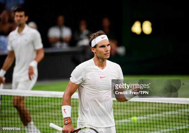 Rafael Nadal of Spain celebrates against Novak Djokovic of Serbia in the semi final of the gentlemen's singles at the All England Lawn Tennis and...
